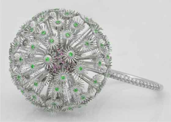 The Dandelion ring in platinum set with diamonds, emeralds and pink sapphires. © Christian Tse