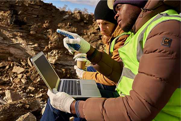 03-Miners using a laptop